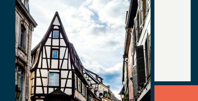 Half timbered houses on a cobblestone street in Colmar France.